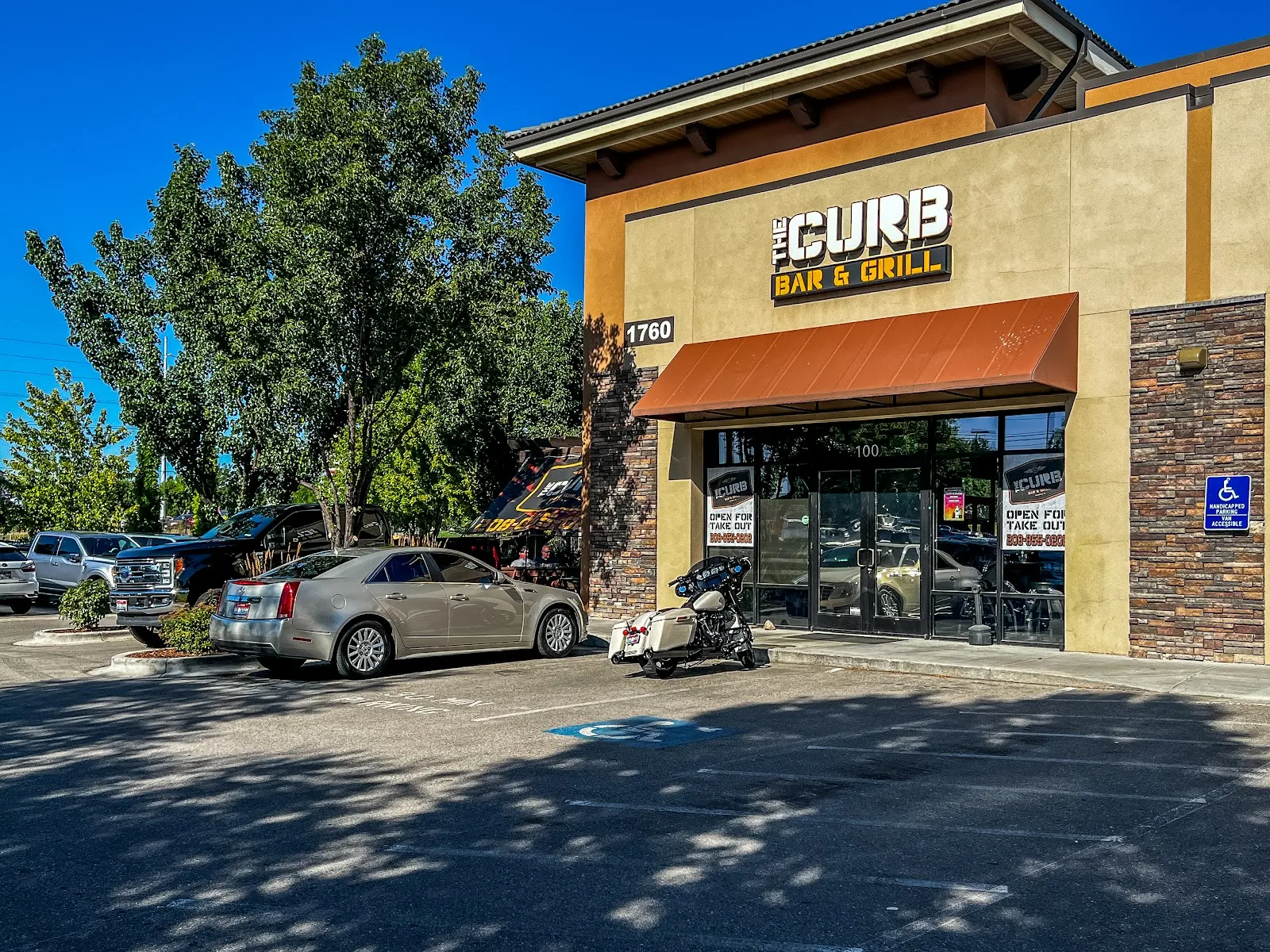 The Curb Bar and Grill logo