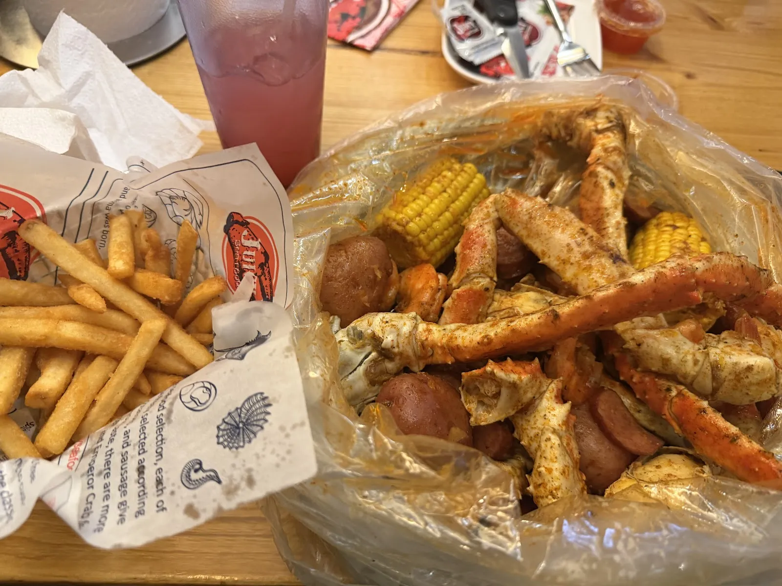 The Juicy Seafood Restaurant & Bar- Harvard Park logo