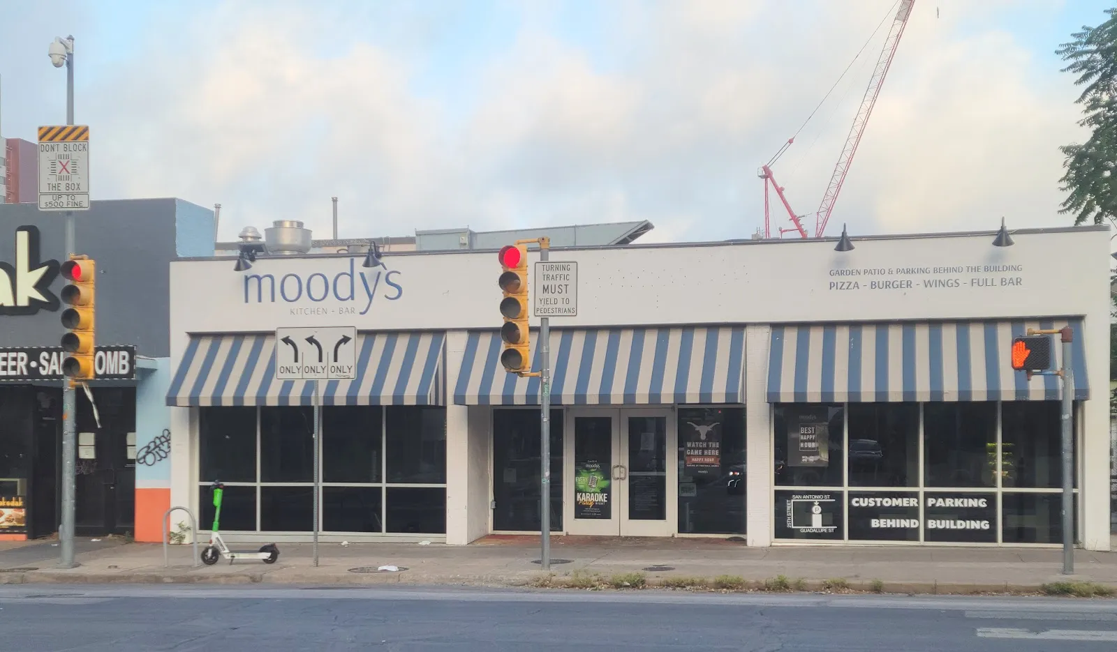 Moody's Kitchen and Bar logo