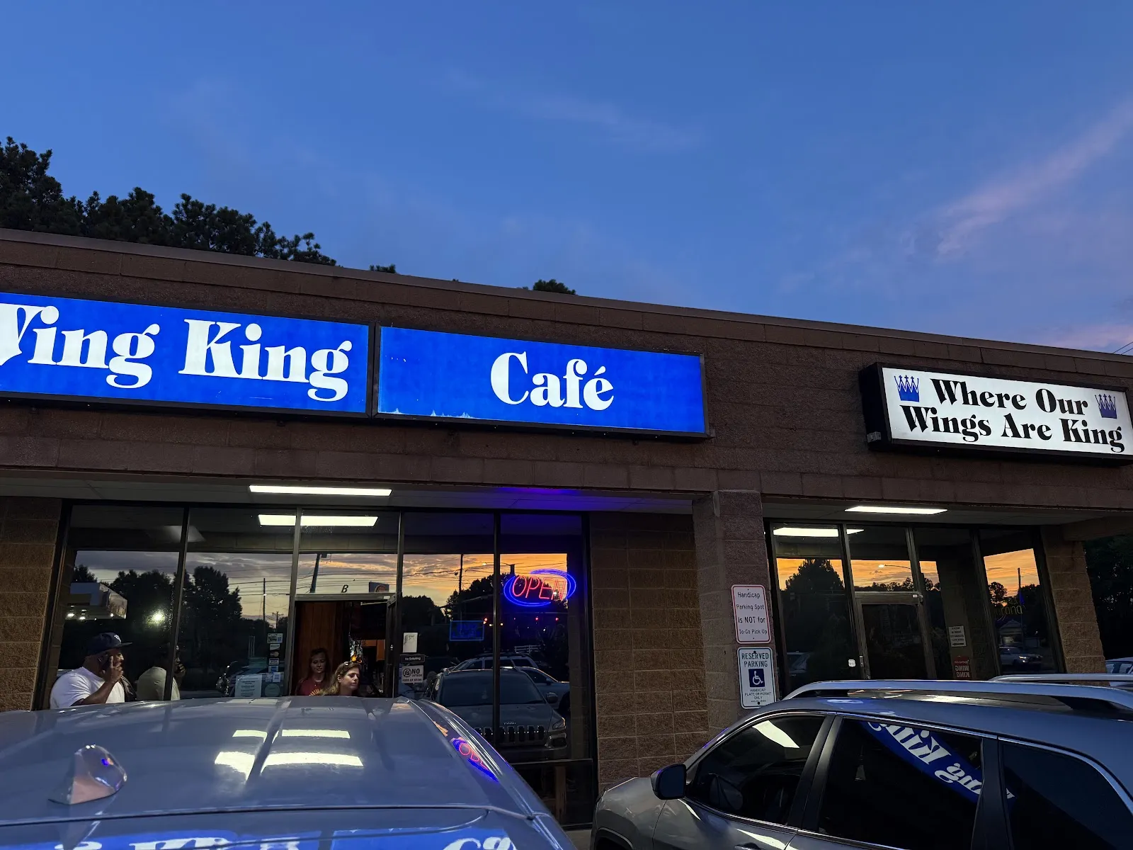 Wing King Cafe logo